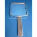 an antique silver mirror and brush