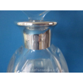 a crystal Orrefors decanter with silver mounting