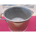a vintage copper pan with lid