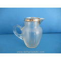een antieke draadglas melkkan met zilveren montuur