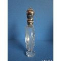 an antique crystal perfume bottle with silver top   