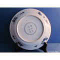 a set of three porcelain plates with Chinese decoration