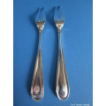a pair of vintage Dutch silver meat forks