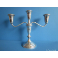 a sterling silver weighted candelabra