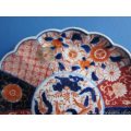 an antique Japanese imari porcelain plate