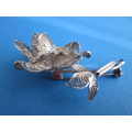 a vintage silver filigrain brooch