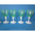 a set of eight etched antique green crystal wine glasses