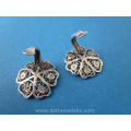 a pair of antique silver earrings