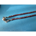 an antique glass garnet necklace with silver clasp