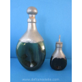 a pewter mounted art deco glass decanter
