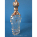 an antique crystal Bohemian perfume bottle with golden top