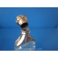an antique crystal Bohemian perfume bottle with golden top