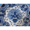 an 18th century Delft earthenware charger
