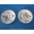 a pair of antique Lowestoft porcelain cups and saucers