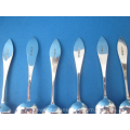 a set of twelve antique Dutch silver teaspoons including matching sugar spoon