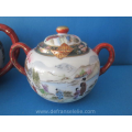 an antique Japanese satsuma porcelain tea set