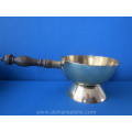 an antique brass handled pan
