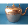an antique Victorian copper tea kettle 