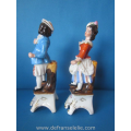 a pair of antique German polychrome porcelain figures