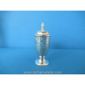 an antique sterling silver hammered pepper caster