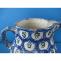 an antique earthenware jug