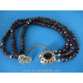 an antique three strand garnet bracelet with 14ct gold closure