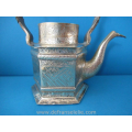 an antique Indonesian brass kettle