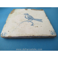 an antique Dutch Delft tile bird