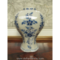 an antique hand painted earthenware Makkum Tichelaar vase