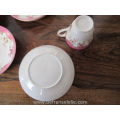 a set of ten antique French porcelain cups and saucers