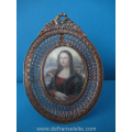 an antique miniature watercolor painting in brass frame