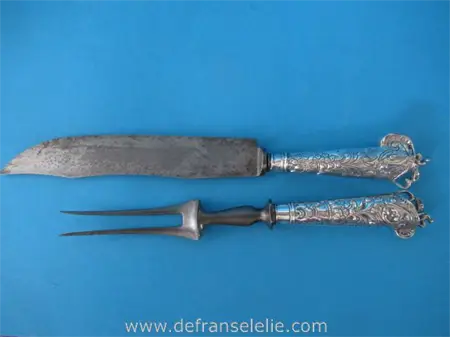 een antiek Hollands bewerkt zilveren mes en vork