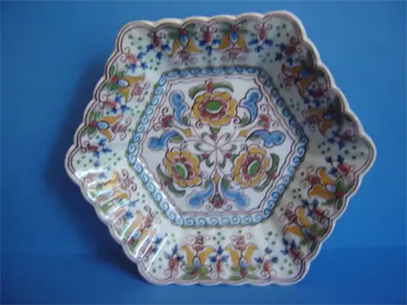 an earthenware hand painted polychrome Makkum dish
