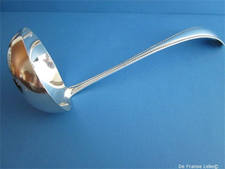  an antique Dutch silver soup ladle