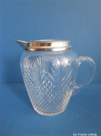 an antique Dutch silver mounted crystal milk jug