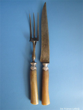 an antique horn cutlery set with silver mounts