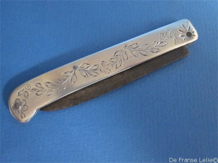 an antique silver pocket knife