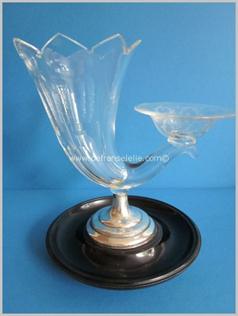 an antique crystal cigar beaker on a silver and ebonised mahogany foot