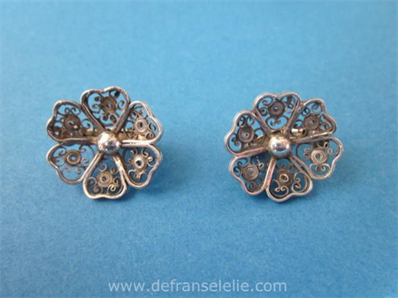a pair of antique silver earrings