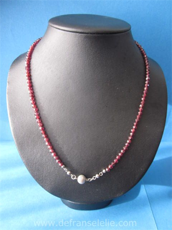 an antique glass garnet necklace with silver clasp