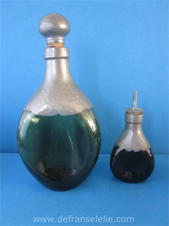 a pewter mounted art deco glass decanter