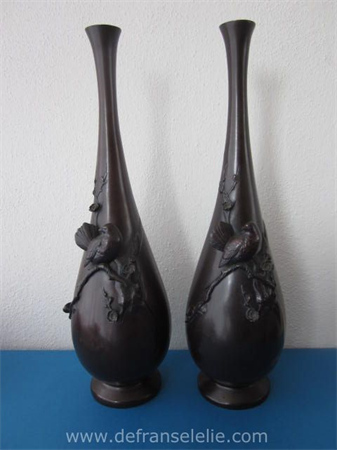a pair of antique Japanese bronze patinated Meiji vases