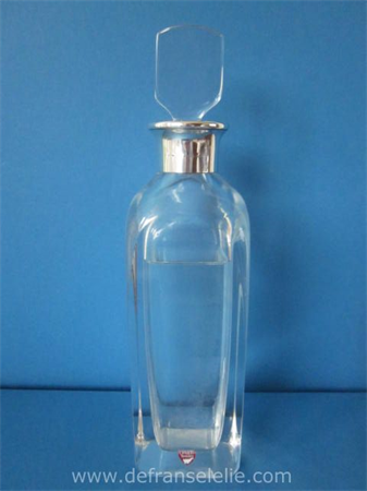 a crystal Orrefors decanter with silver mounting