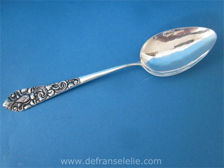 a Yogya silver vegetable serving spoon