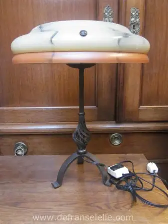 a vintage wrought iron lamp