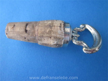 an antique Dutch silver bottle stopper
