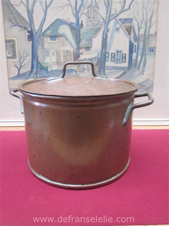 a vintage copper pan with lid