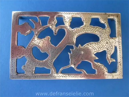 a vintage Chinese brass dragon trivet 