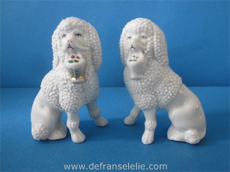 a pair of antique German porcelain poodles