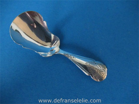 an antique Dutch silver engraved sugar spoon